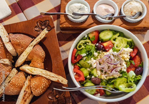 Tableau sur toile Greek Village Salad, bread and dips in restaurant in Cyprus island country