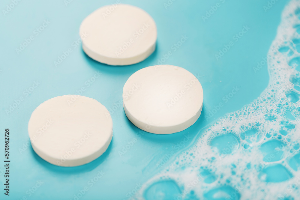 Three bars of round soap with foam Three bars of round soap with foam