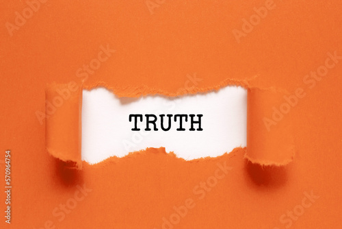 The word Truth appearing behind torn orange paper. photo