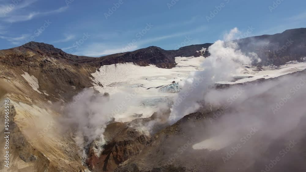 AERIAL The crater of Mutnovsky volcano with fumaroles and volcanic gases AERIAL The crater of Mutnovsky volcano with fumaroles and volcanic gases