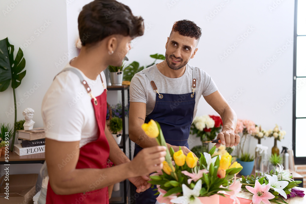 Two hispanic men florists smiling confident make bouquet of flowers at flower shop Two hispanic men florists smiling confident make bouquet of flowers at flower shop