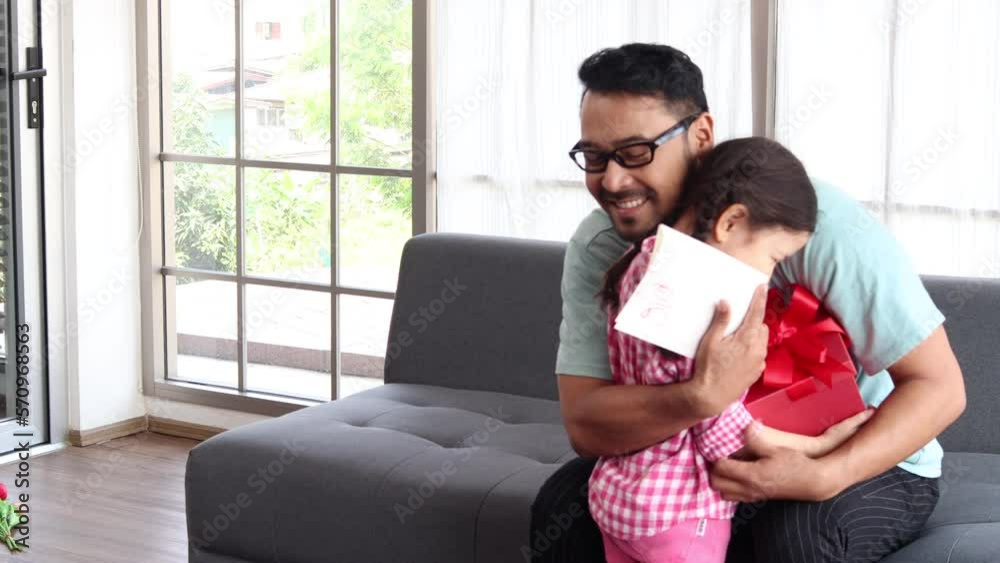 Happy Father's Day, father hug and kiss his adorable cute little girl