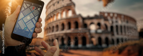 Canvas Print Traveller using smartphone navigator map find Coliseum in Italy Rome