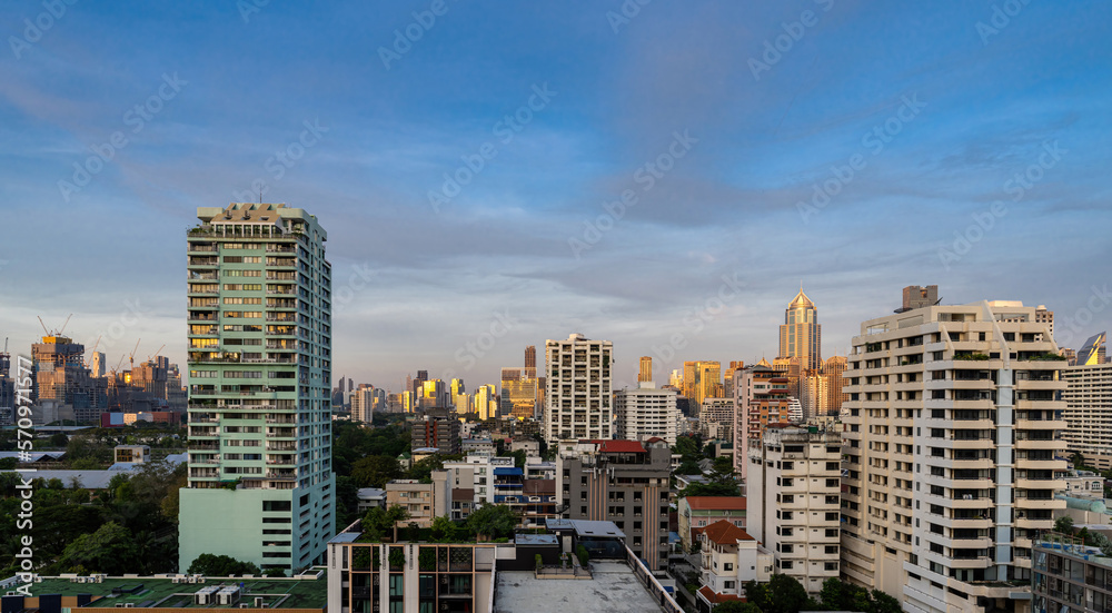 Sunrise over the houses and skyscrapers of Bangkok, Sukhumvit, Thailand.