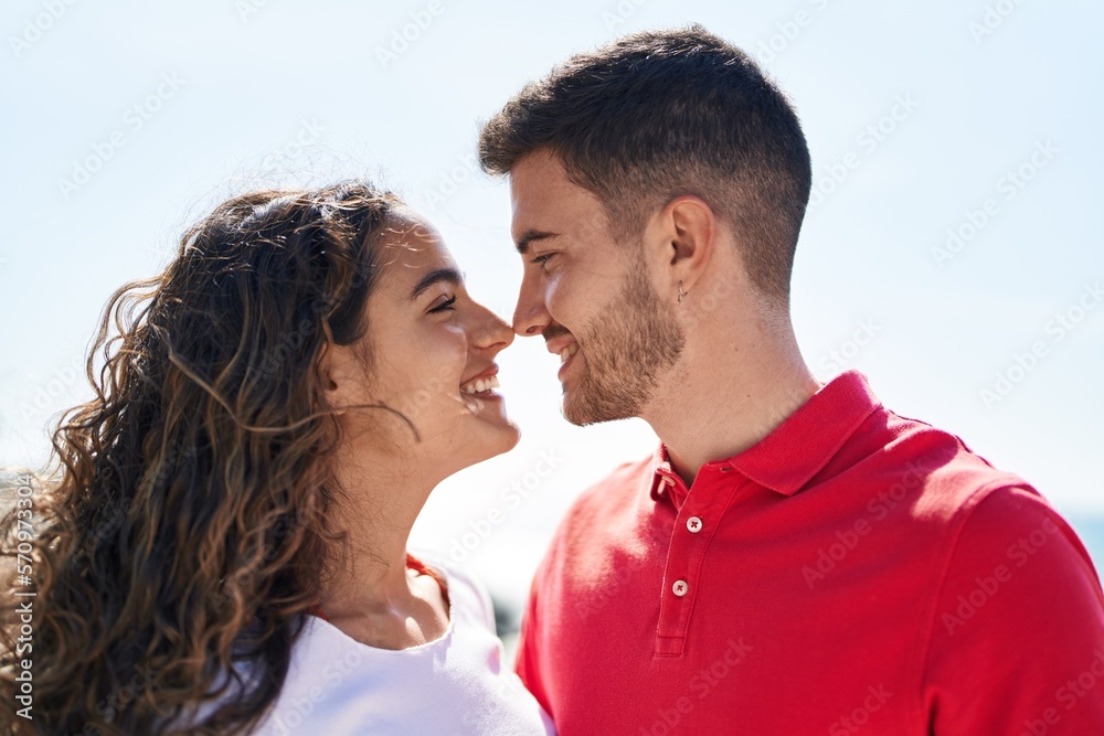 Young hispanic couple smiling confident standing together at seaside Young hispanic couple smiling confident standing together at seaside