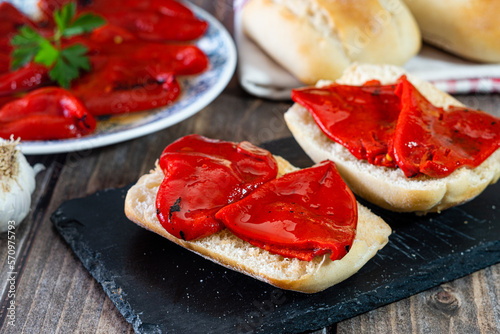 Piquillo peppers roasted in the oven, with bread. photo
