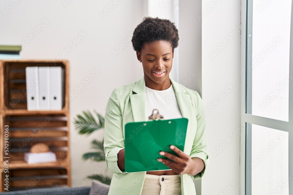 African american woman psychologist holding clipboard at psychology center African american woman psychologist holding clipboard at psychology center