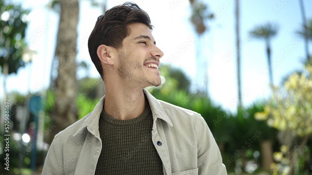 Young hispanic man smiling confident looking to the side at park Young hispanic man smiling confident looking to the side at park