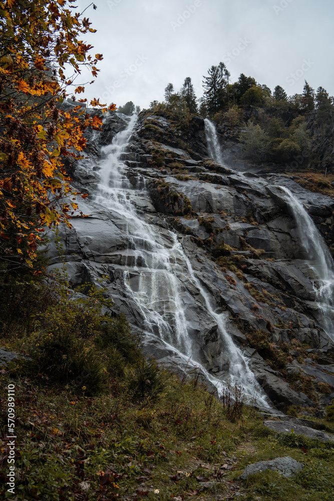 Fototapeta premium The Nardis Waterfall in Trentino Alto Adige during a foggy and rainy day in autumn, Northern Italy