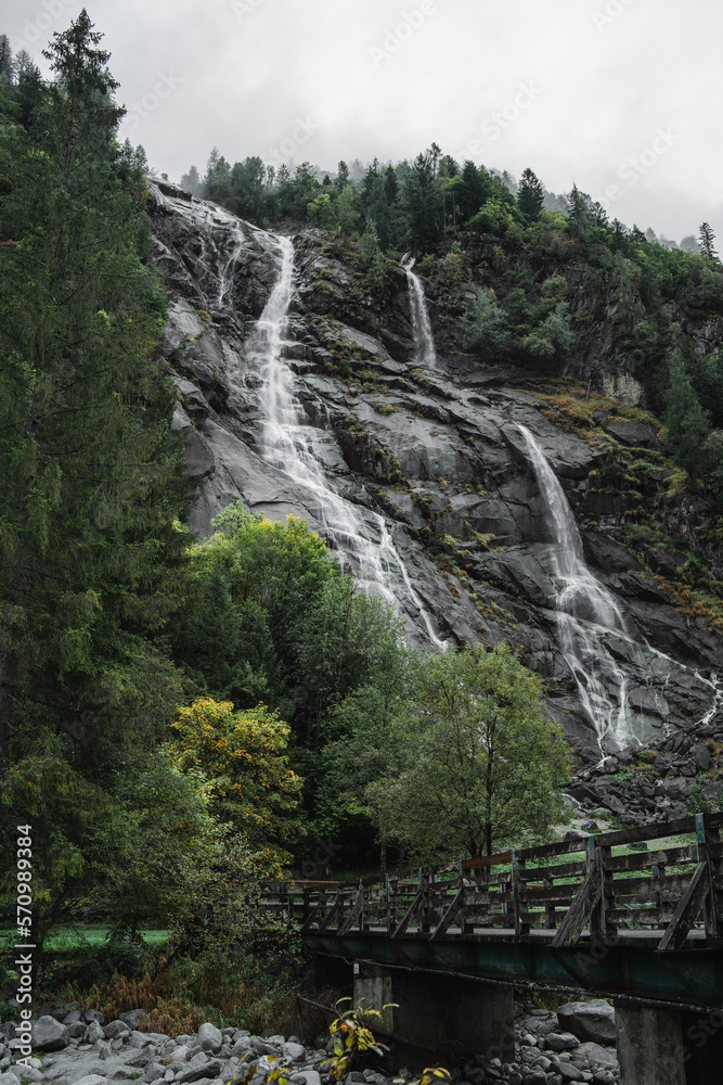 The Nardis Waterfall in Trentino Alto Adige during a foggy and rainy day in autumn, Northern Italy