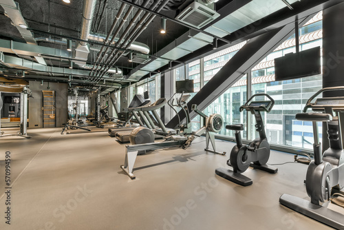 Modern gym with training equipment photo