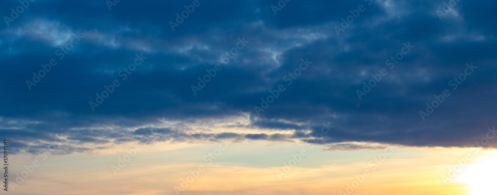 Dark clouds in the blue sky during sunset