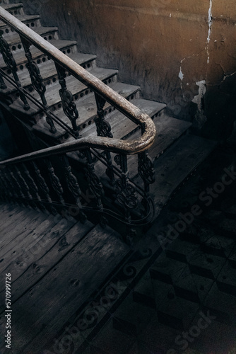 wooden railings in an old dark entrance