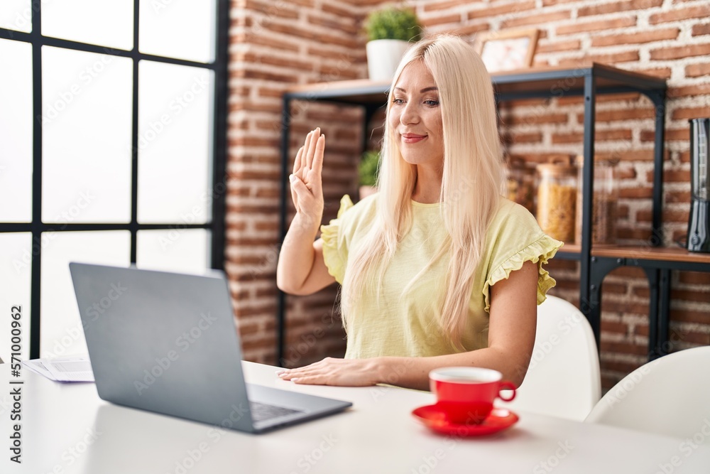 Young blonde woman having video call using deaf language at home Young blonde woman having video call using deaf language at home