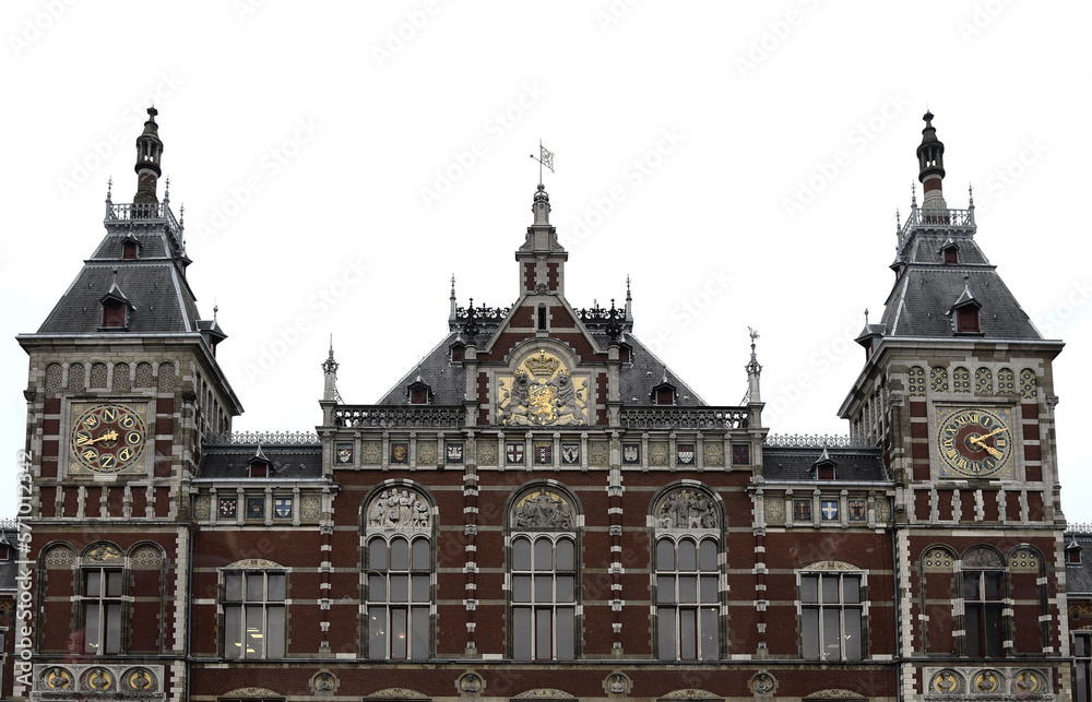 Amsterdam Central station building on a clouded day with white sky Amsterdam Central station building on a clouded day with white sky