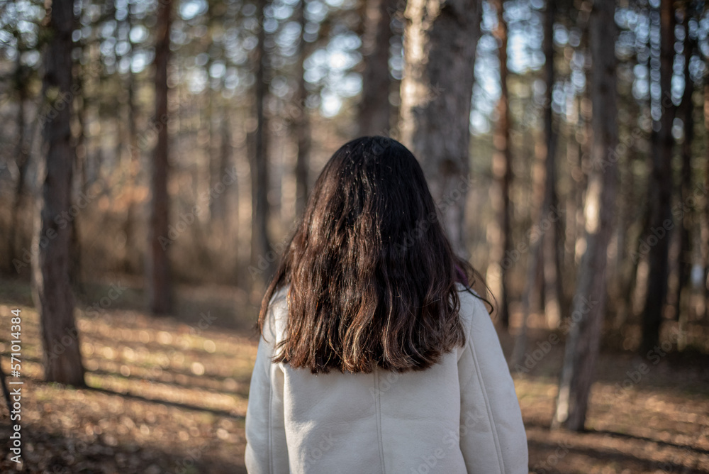 woman walking in the woods woman walking in the woods