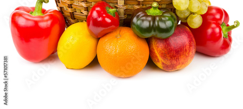 Fruits and vegetables in a basket isolated on a white .
