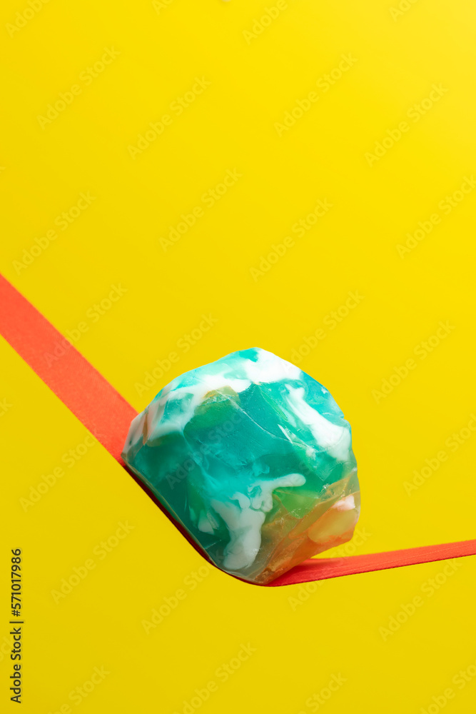 Turquoise handmade soap on a yellow background. Close-up. Turquoise handmade soap on a yellow background. Close-up.