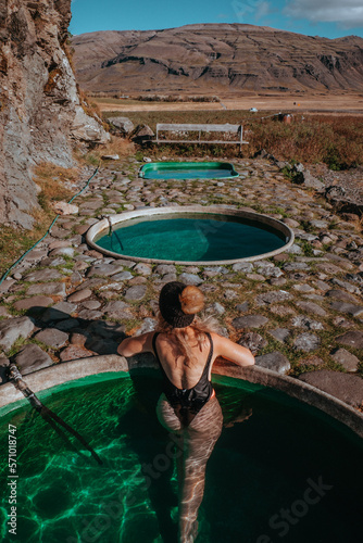 Woman enjoying sunset at Hoffel Hot Tubs, Iceland