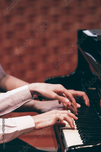 Indoor concert background abstract people playing music instruments in symphony orchestra piano dual performance arts rehearsals chamber music