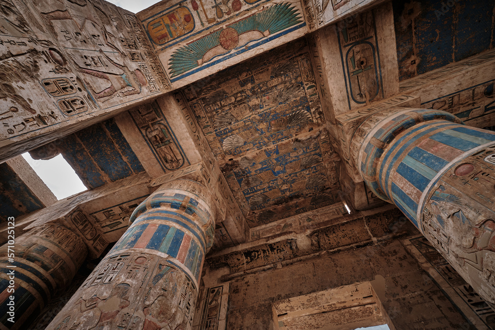 Mortuary Temple of Ramesses III at Medinet Habu in Luxor, Egypt showing Ceiling decoration in the peristyle hall with preserved colors