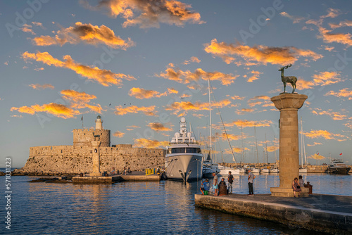 Afternoon view with the Mandraki Marina Port, symbolic deer statues where the Colossus of Rhodes stood. Rhodes, Greece