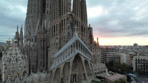 Sunrise drone aerial of the Basilica Sagrada Familia. 
 The iconic church has been in construction for over a century but is scheduled for completion in 2026.