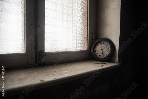 Old and vintage blank clock dial without hand on old wooden table