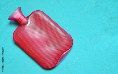 Photography A hot water bag . Image isolated on a blue background