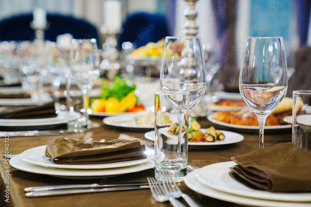 a festive served table with snacks and tableware.