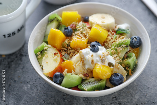 Muesli with fruits served in bowl
