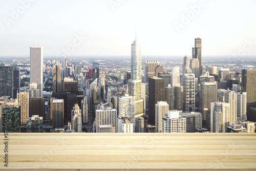 Blank wooden table top with beautiful Chicago skyline at daytime on background  mockup