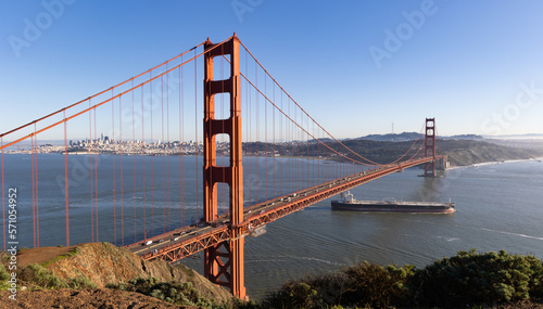  A cargo ship passes under the Golden Gate Bridge