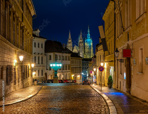 Old street of Hradcany and gothic St. Vitus Cathedral in Prague, Czech Republic. Architecture and landmark of Prague. Night cityscape of Prague.