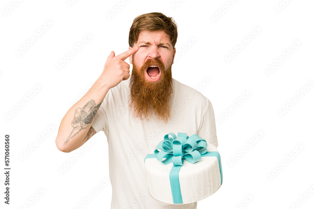 Φωτογραφία Adult man holding a sweet cake recently made isolated cut out showing a disappointment gesture with forefinger
