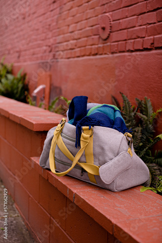 full duffel bag on red brick