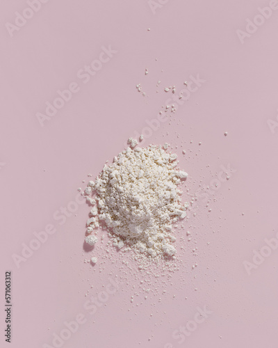 Cosmetic clay. Clay facial mask on a pink background. Natural cosmetics for cosmetic procedures. Beauty concept.