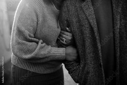 black and white portrait of arms snuggled