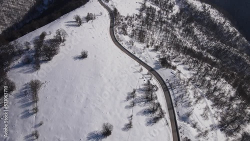 Old Mountain Balkan Stara Planina Babin Zub tourist resort in winter day covered with snow empty road photo