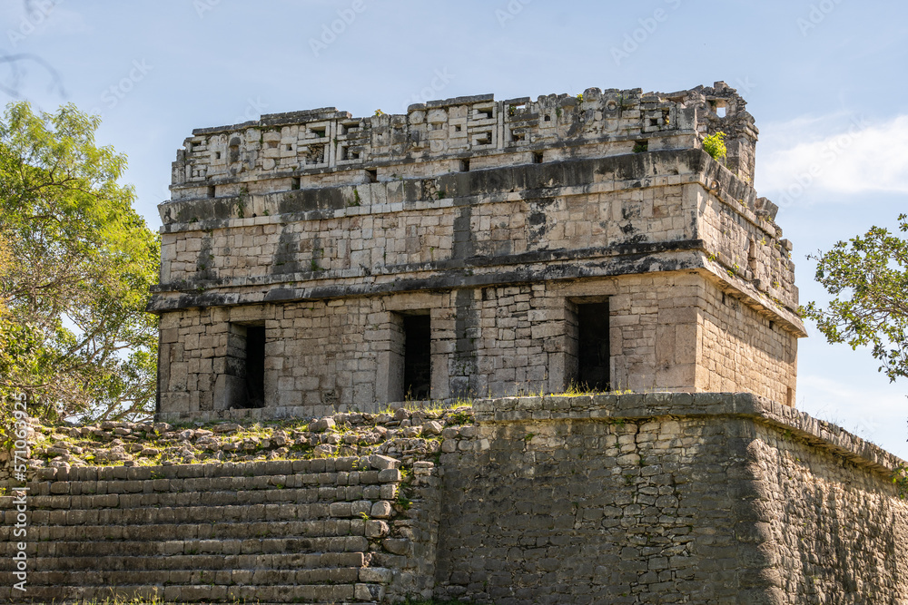 The ruins of a beautiful pyramid in the archaeological zone of Chichen Itza in Mexico.