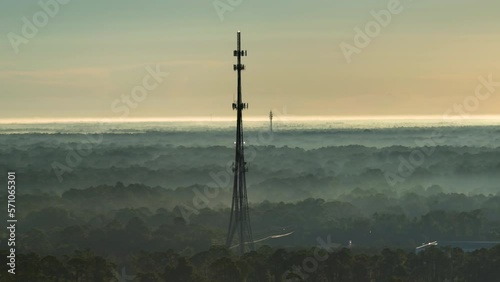 Aerial view of telecommunications cell phone tower with wireless communication 5g antennas for network signal transmission