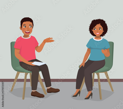 Young African woman having psychotherapy counseling session with male psychotherapist in the office