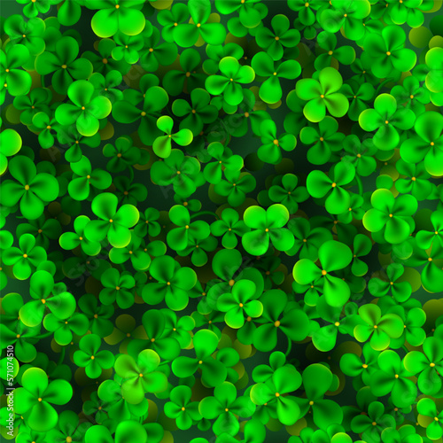 Seamless pattern for St. Patrick's Day made of realistic clover leaves in green colors
