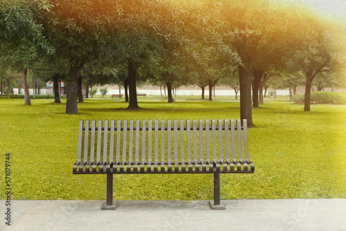 Stylish metal bench in park on sunny day