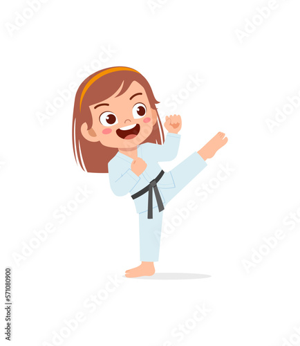 cute little kid training and showing karate pose