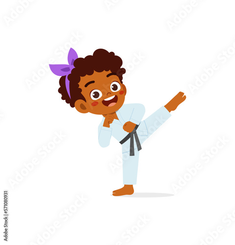 cute little kid training and showing karate pose