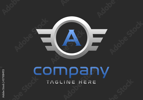 A letter logo inside a winged silver ring.