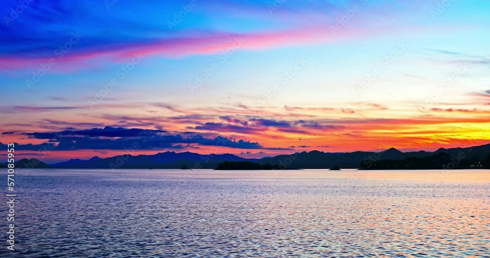 Beautiful lake and mountain with colorful sky clouds at sunset in Hangzhou, Zhejiang Province, China. Beautiful lake and mountain with colorful sky clouds at sunset in Hangzhou, Zhejiang Province, China.