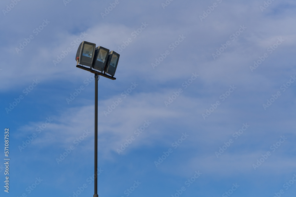 beach lamppost on background of blue sky with clouds beach lamppost on background of blue sky with clouds