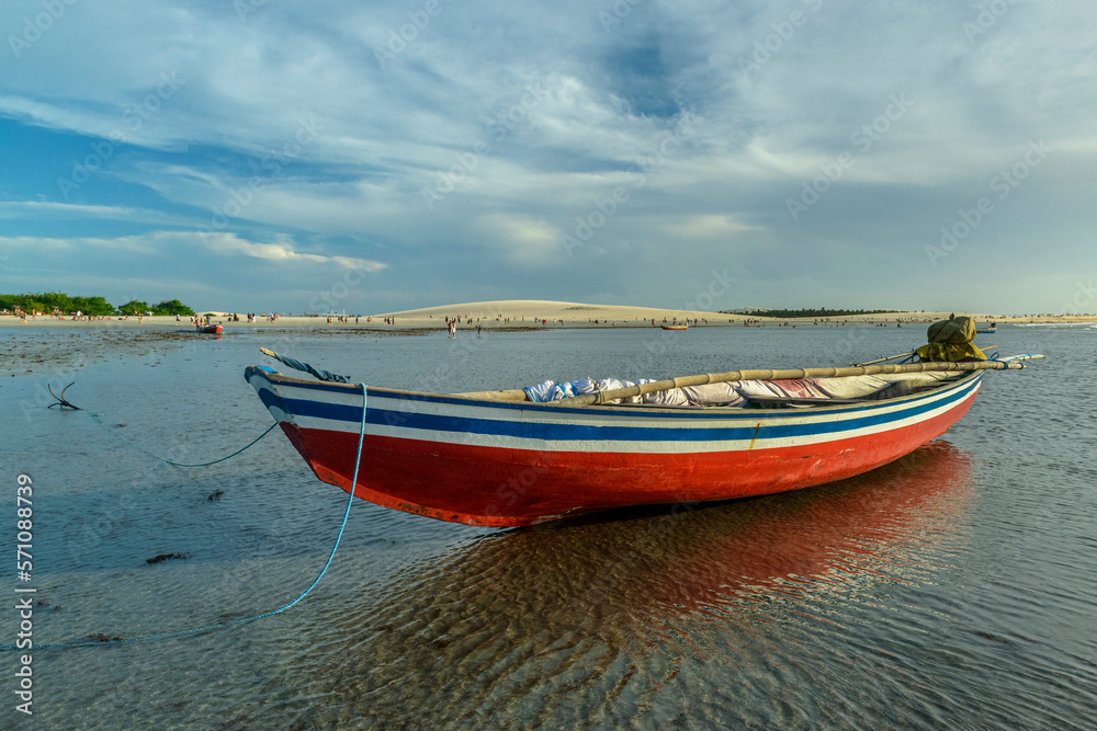 Jericoacoara Beach, Ceará, Brazil on January 19, 2023. Fishing boats at low tide on the beach.